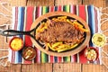 roast beef with seasonings and sliced Ã¢â¬â¹Ã¢â¬â¹barbecue salad served on plate on wooden table Royalty Free Stock Photo